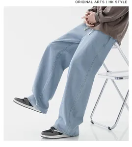 Detail of light blue wide-leg jeans with white drawstring waist and soft drape fabric