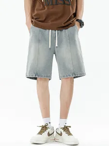 Men's loose gradient denim shorts with elastic drawstring waist and vertical seam detailing