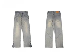 Detailed front and reverse view of vintage wash jeans with hem zipper and panelling