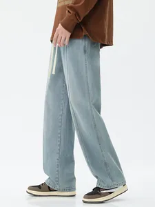 Jean large bleu clair pour hommes avec délavage vintage et taille à cordon