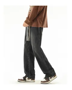 Detailed side view of washed gray straight-leg jeans with elastic drawstring waist