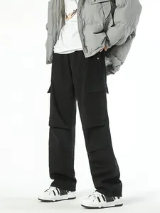 Men's loose fit black cargo jeans with multi-pocket design and wide leg streetwear cut