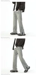 Detail view of washed vintage flare denim with side zippers and patchwork craftsmanship