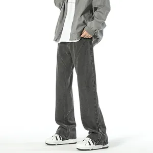 Men's washed grey wide leg denim jeans featuring split zipper hem and panel stitching