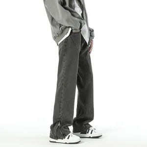 Men's washed dark grey flared jeans with side zippers and geometric seam details