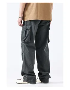 Detail of vintage loose fit cargo pants showing large flap pockets and washed fabric texture