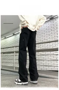 Close-up of black straight-leg work pants with durable twill cotton fabric details