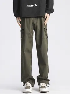 Men's army green functional cargo pants with adjustable hem and large side pockets