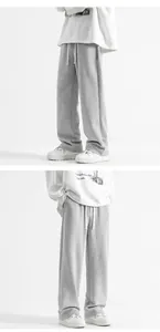 Détail de la taille élastique avec cordon blanc sur un pantalon de jogging gris
