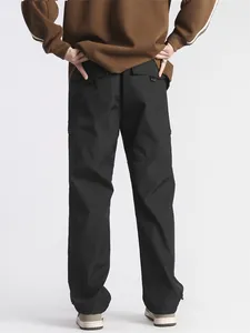 Mens black functional cargo pants in a loose straight fit with back flap pockets