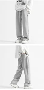 Détail du jogging gris large avec taille élastique à cordon et poches latérales
