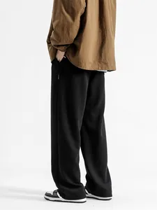 Pantalon de détente noir large pour hommes avec un drapé lourd et une taille à cordon
