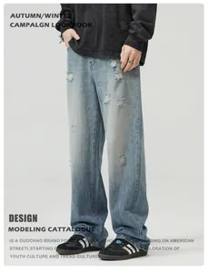 Detailed close-up of light blue distressed denim with frayed holes and washed texture