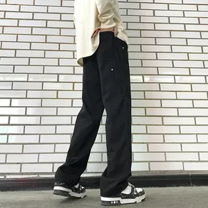 Men's loose straight-leg double-knee cargo pants in black with metal rivet details