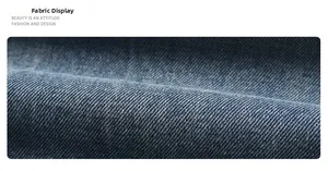 Macro detail showing the blue twill texture and fabric weave of American style denim jeans