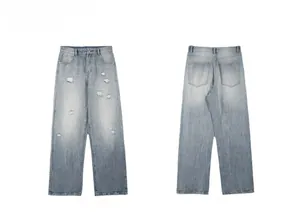 Flat lay of light blue distressed jeans showing front and reverse details of the denim