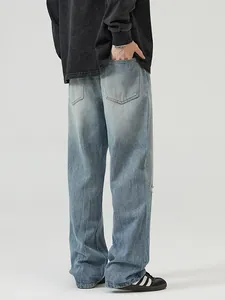 Men's relaxed fit wide leg denim jeans with vintage washed light blue finish