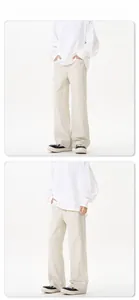 Detail show of men's wide-leg beige casual pants in cotton twill fabric for cleanfit look