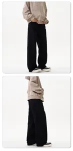 Detail view of American minimalist loose straight-leg casual pants and gray zip hoodie