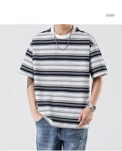 Detail of blue and white striped crew neck t-shirt with drop shoulder design