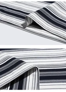 Detailed macro view of striped knit fabric texture and double-needle stitching quality