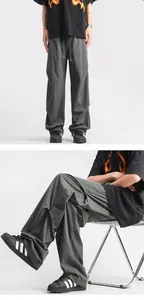 Detail of grey-green lightweight parachute cargo pants with drawstring elastic waist