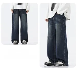 Detail view of retro washed dark blue wide-leg jeans with vintage whiskering and distress
