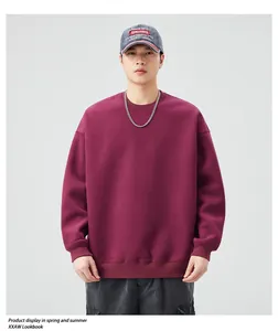 Detail of burgundy oversized crewneck sweatshirt featuring drop shoulders and premium cotton