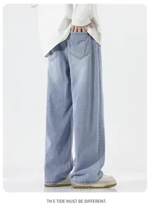 Detail view of the light blue wide-leg denim jeans showing back pockets and stitching