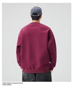 Rear view of a heavy burgundy crewneck sweatshirt featuring drop shoulder style