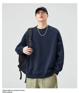 Detail of heavy 405g navy crewneck sweatshirt with ribbed collar and dropped shoulder