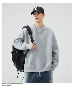 Close-up of a premium 405g heavy light grey crewneck sweatshirt with relaxed drop shoulders