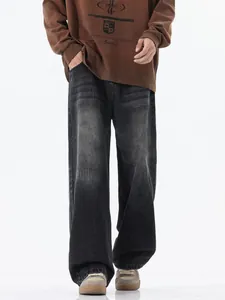 Mens vintage smoked grey wide leg jeans with washed cat whiskers in American retro style