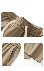 Détail du pantalon cargo kaki avec taille élastique à cordon et ourlet de jambe droit
