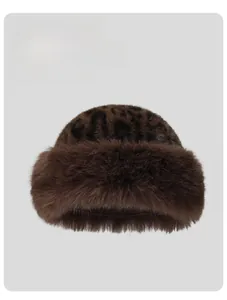 Detail of leopard print faux fur winter hat showing thick plush texture and soft fiber