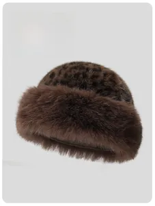 Detail view of the thick plush leopard print faux fur hat with warm fluffy trim