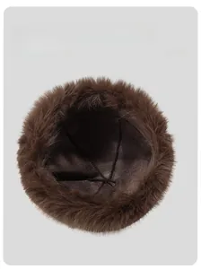 Detailed interior of brown winter fur hat showing thick lining and quality stitching