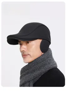 Detail of winter wool flat cap for men featuring foldable ear flaps and warm windproof fabric