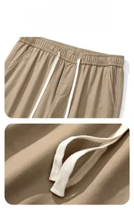 Détails du pantalon cargo kaki avec taille élastique et cordon de serrage rond blanc