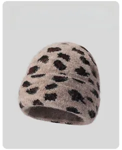 Close-up of leopard print knit beanie showing fuzzy texture and thick warm material