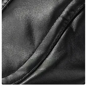 Close-up of black PU leather texture with neat stitching and premium craftsmanship details