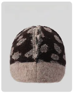 Detail view of thickened fleece lining and knit pattern on leopard print winter hat