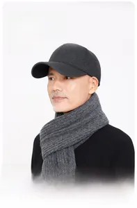Detail showing the structured wide brim and reinforced crown of the wool baseball cap