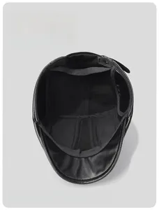 Detail of thickened fleece lining and high-quality stitching on black PU winter cap