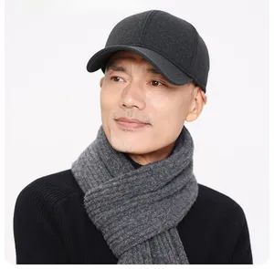 Detail view of dark grey winter baseball cap and knitted scarf set for elderly men
