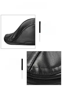 Detail view of premium black PU leather cap with reinforced brim and precision stitching