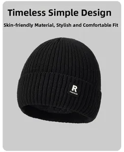 Close-up of thick ribbed knit fabric and R FASHION label on a black winter beanie