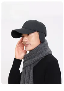 Detail showing foldable earflaps on wool baseball cap for thermal winter protection