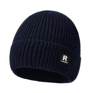 Winter navy blue ribbed knit beanie with R patch label and ear protection for cold weather