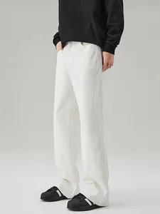 Minimalist white stretch flared jeans for men with cleanfit aesthetic and floor-length cut